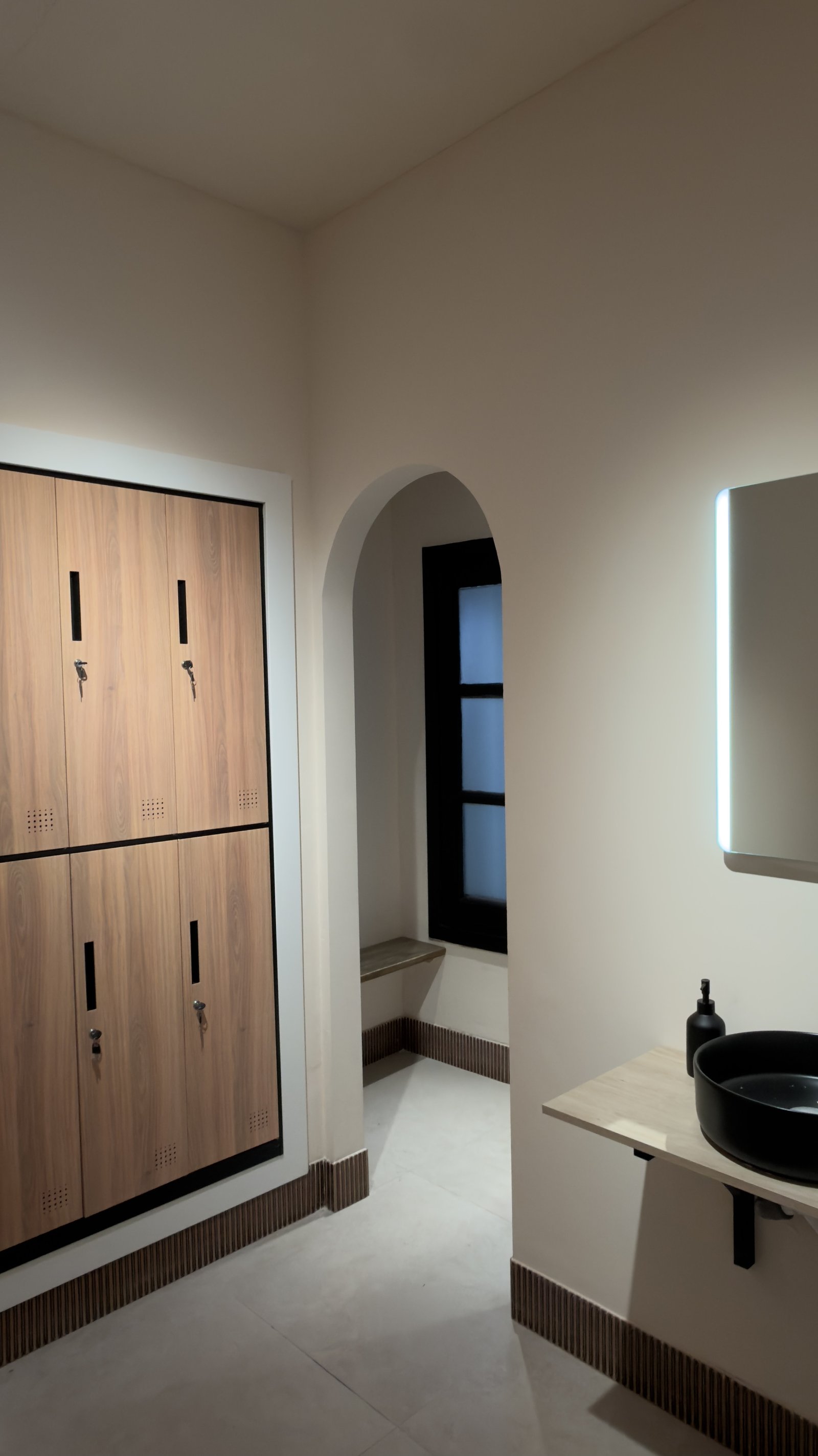 Pureform changing room with oak lockers and arched alcove